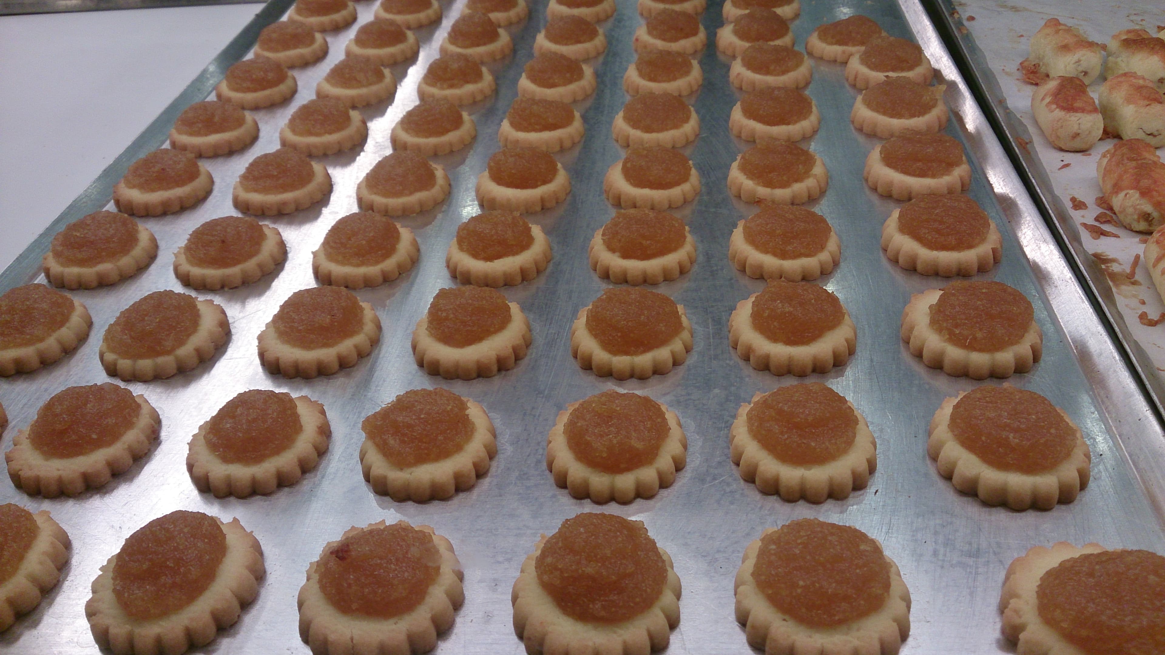 Rows of golden Singapore pineapple tarts, a classic Lunar New Year food gift